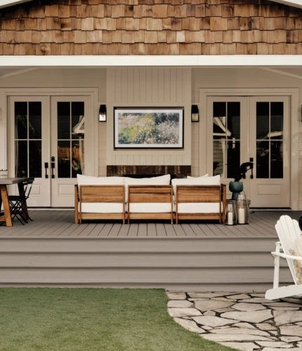 Grey composite deck with outdoor sofa and dining set - Fiberon Cottage decking.
